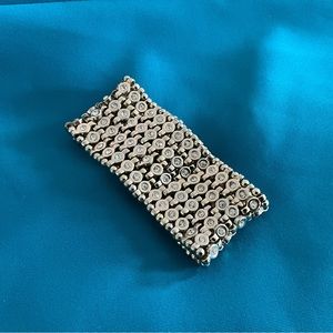 White House Black Market gold bracket with crystal accents